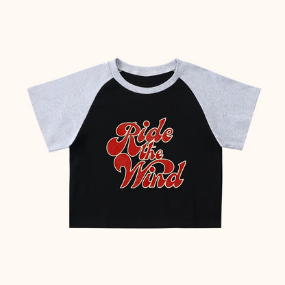 Black and gray raglan shirt with 'Ride the Wind'