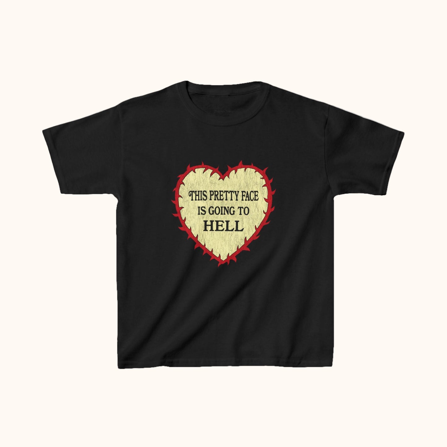 Black t-shirt with a red outline and yellow heart graphic and text on a white background 